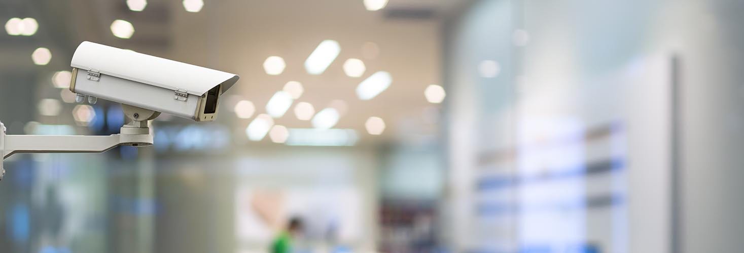 CCTV security camera on monitor the abstract store blurred in hall with bokeh background